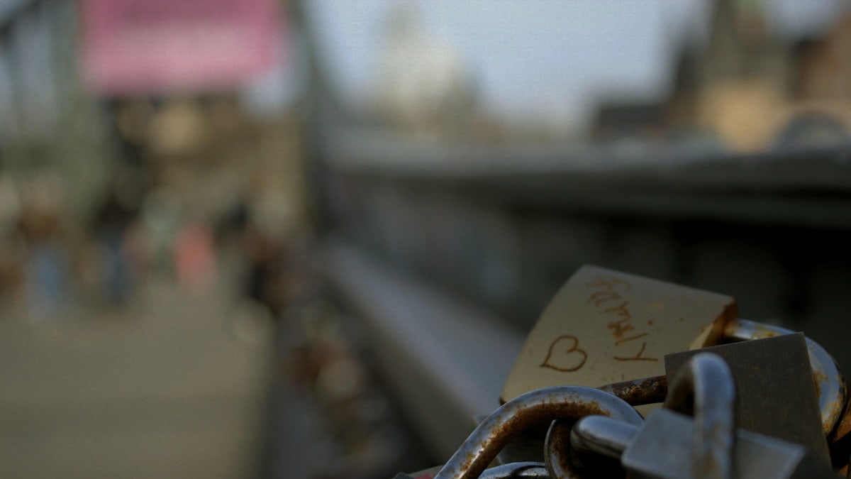 A close up of a padlock on a bridge
